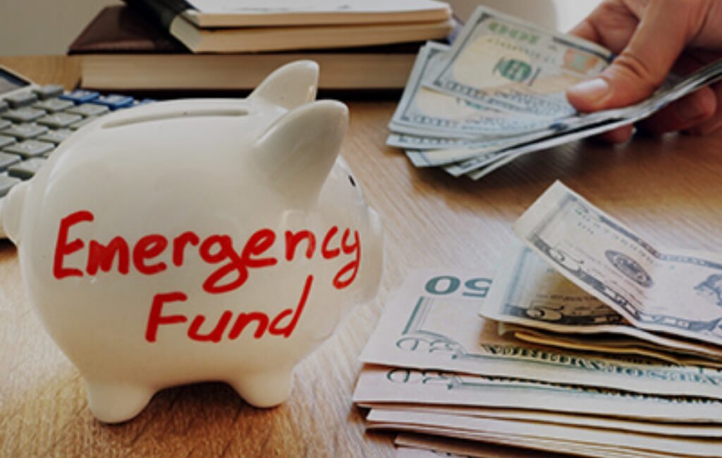 Celebrating a $1,000 savings milestone on a tracker while continuing to build an emergency fund